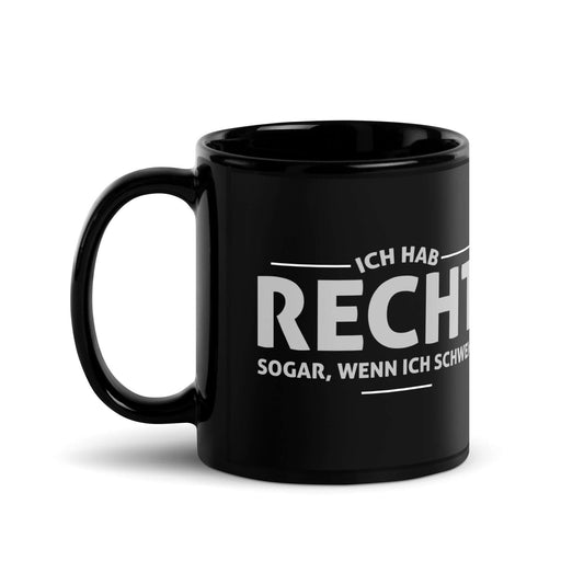 Ich hab recht. Sogar, wenn ich schweige Black Glossy Mug with humorous text on a black ceramic surface.