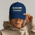 Ich ziele nicht Bio Cap mit frechem Dart-Humor und markantem Bullseye-Design auf blauer Kappe.